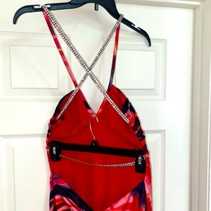 Morgan & Co. Rhinestone criss-cross, open-back gown, mermaid fishtail hem.